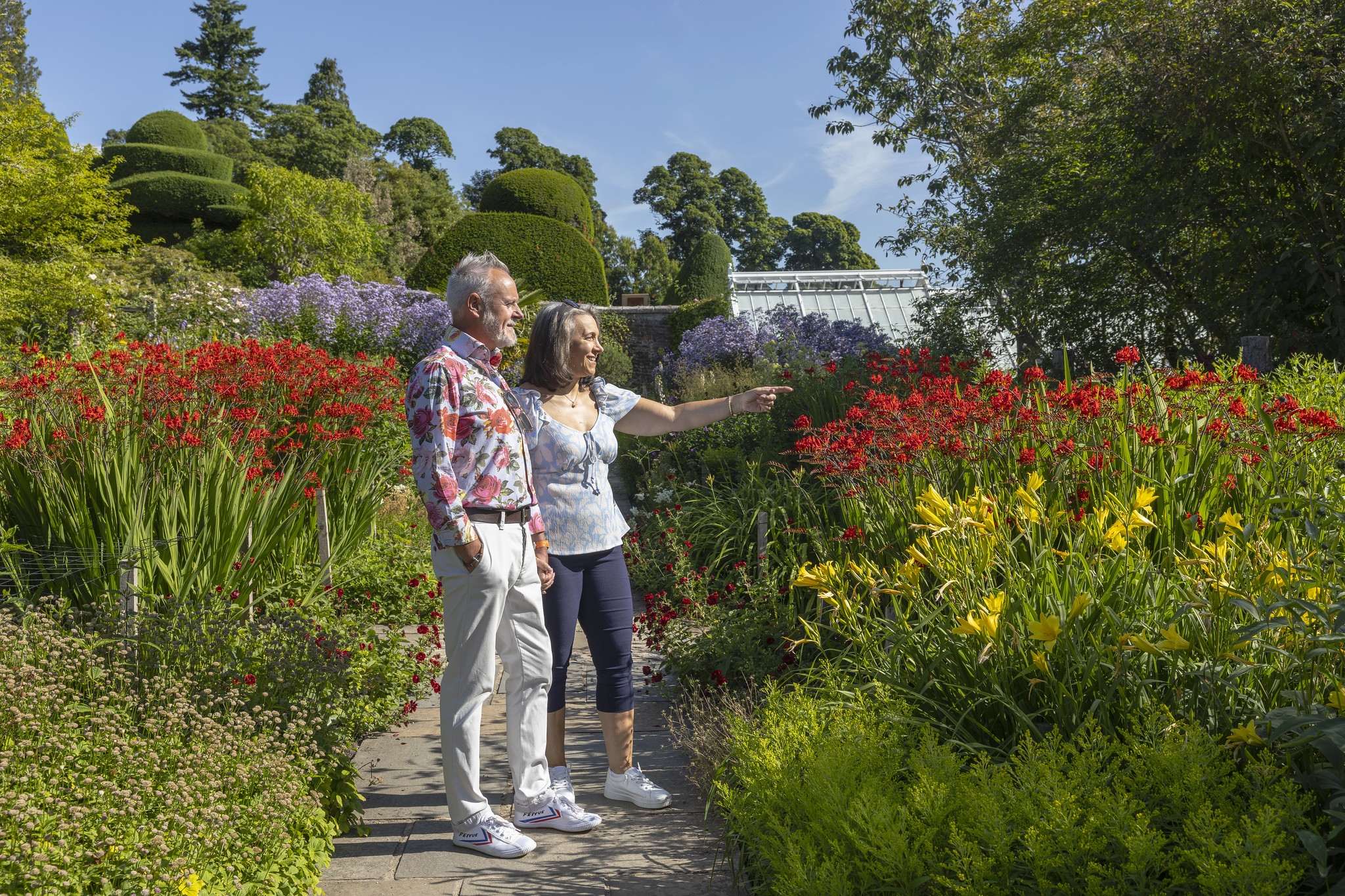 Couple enjoying the summer garden at Crathes Castle