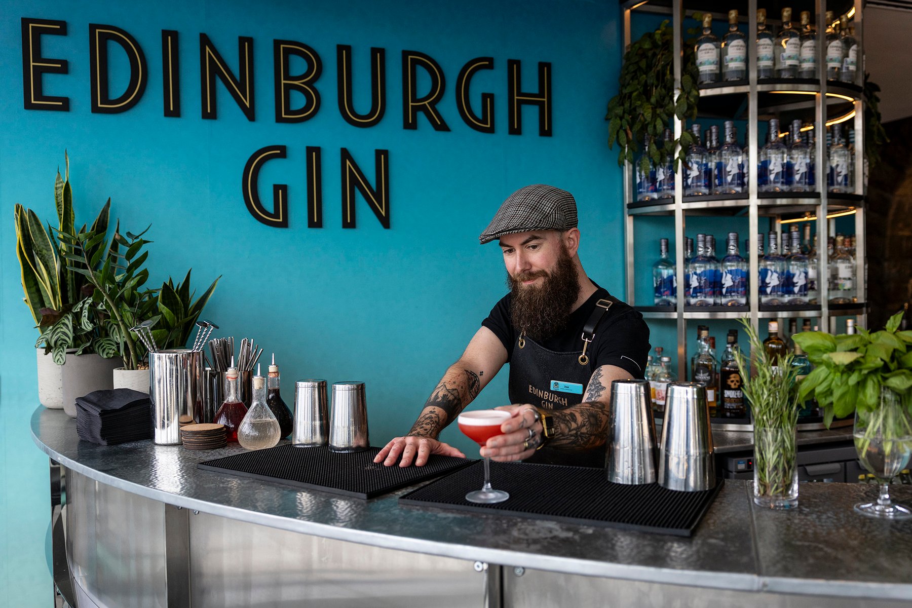 Bartender serving a cocktail at Edinburgh Gin